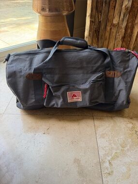 Ozark Trail Charcoal Gray Duffel Bag with Red Accent 25 inches long, 12 in tall